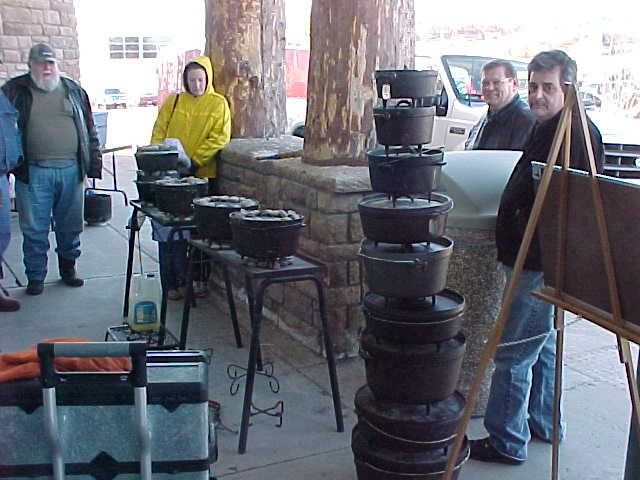 Cooking and a Stack of  Dutch Ovens
